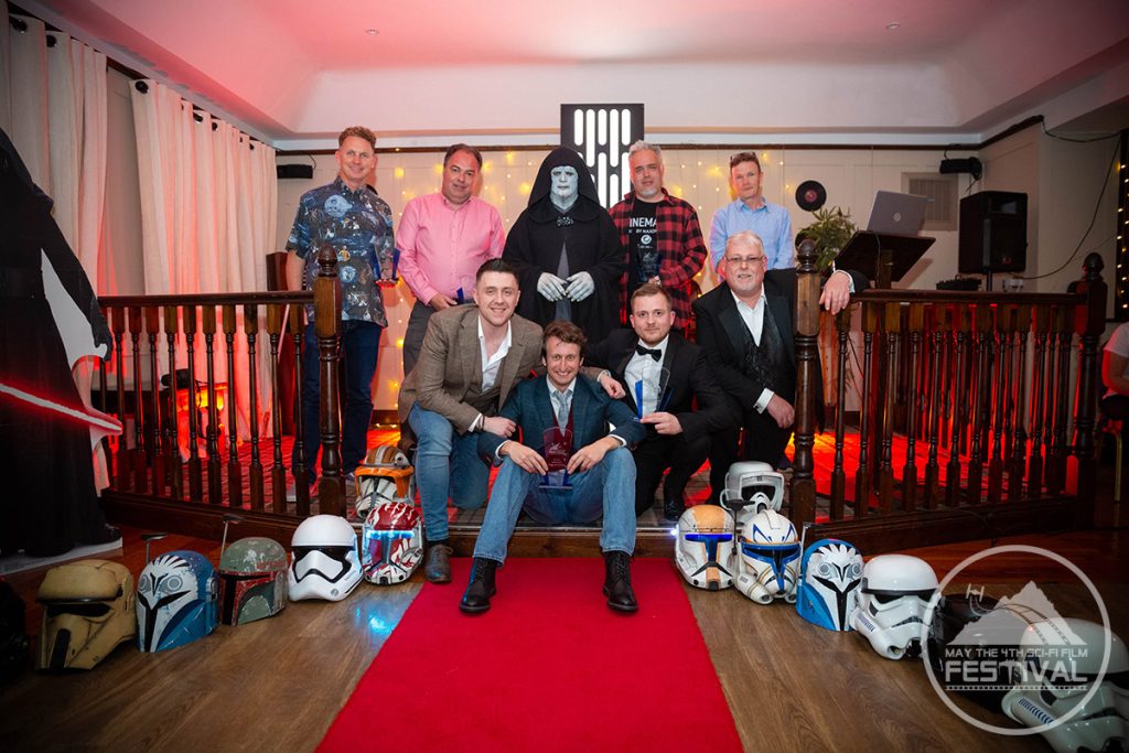 Helmets on the floor with awards gala participants