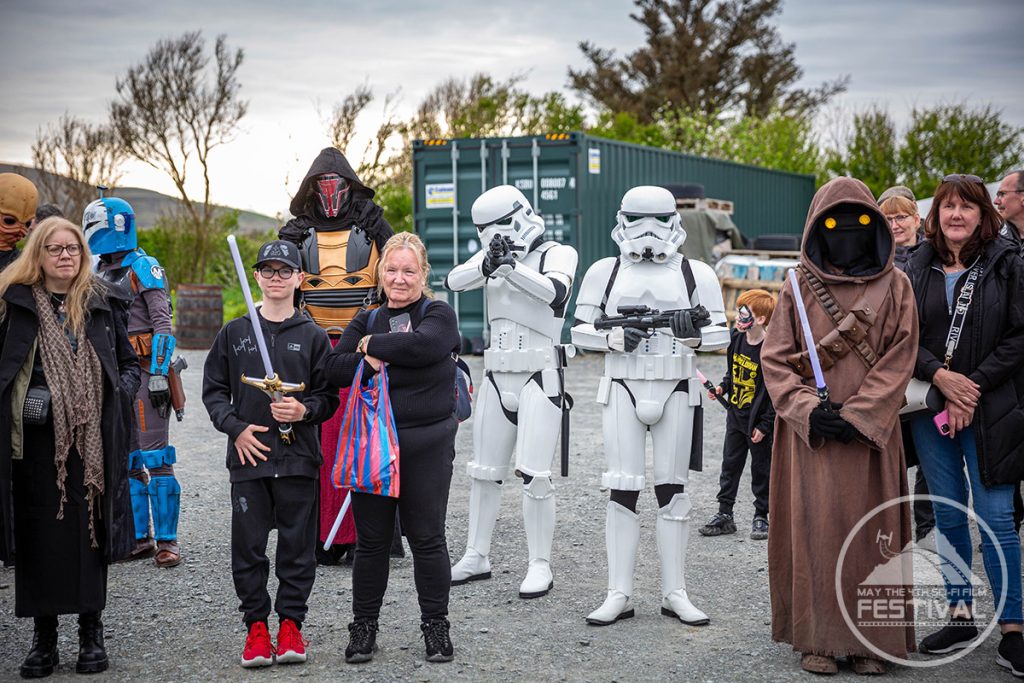 Storm troopers posing with a family