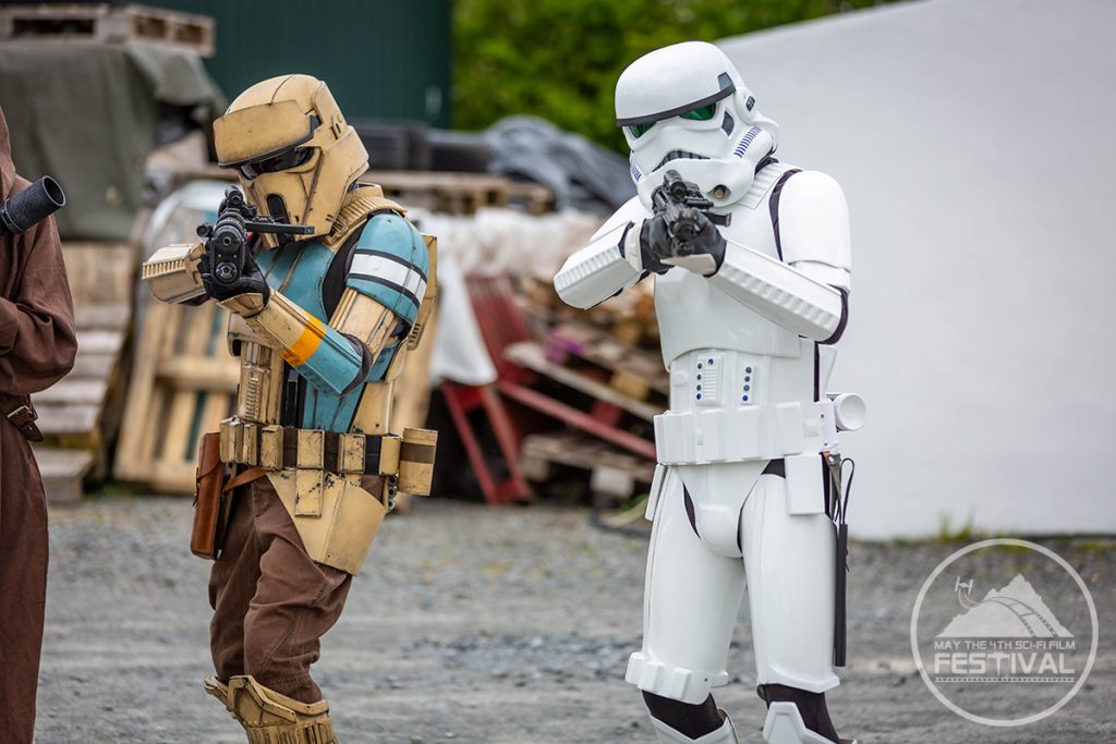 Stormtroopers holding a camera man at gunpoint