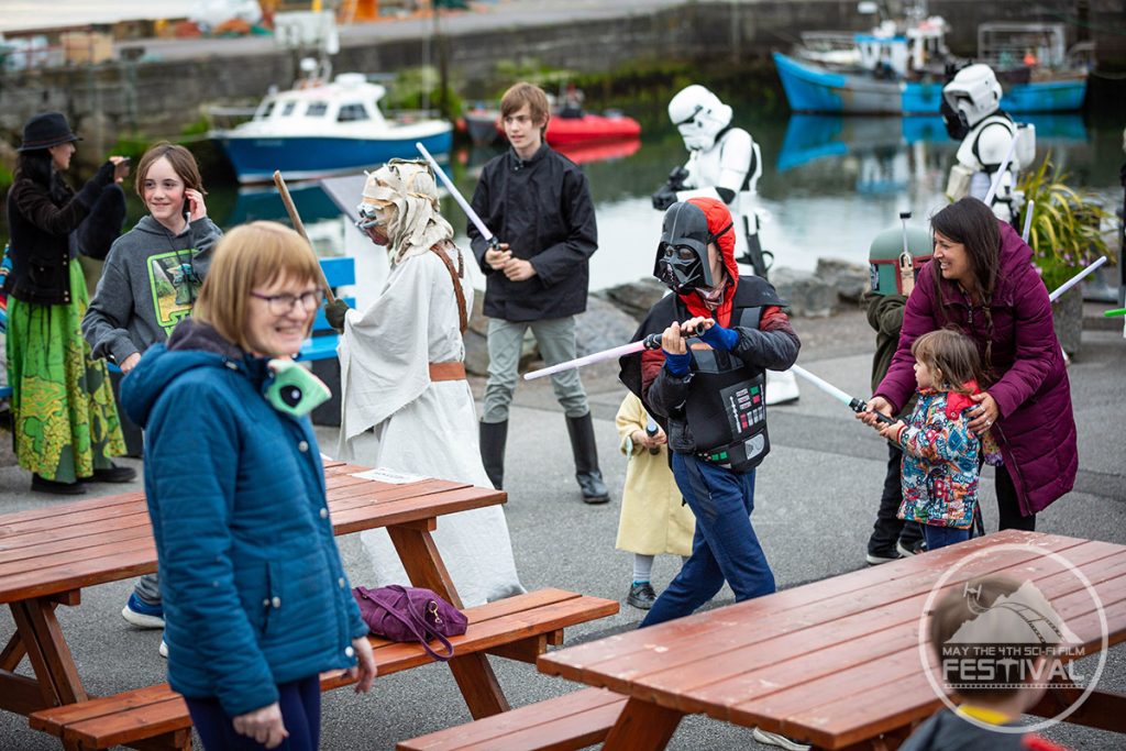 Children having a lightsaber battle