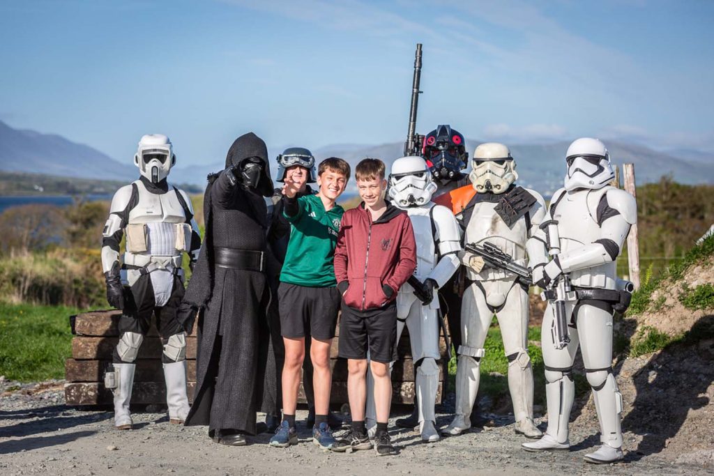 Children posing with star wars characters