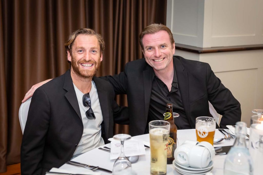 Two actors posing for a photo