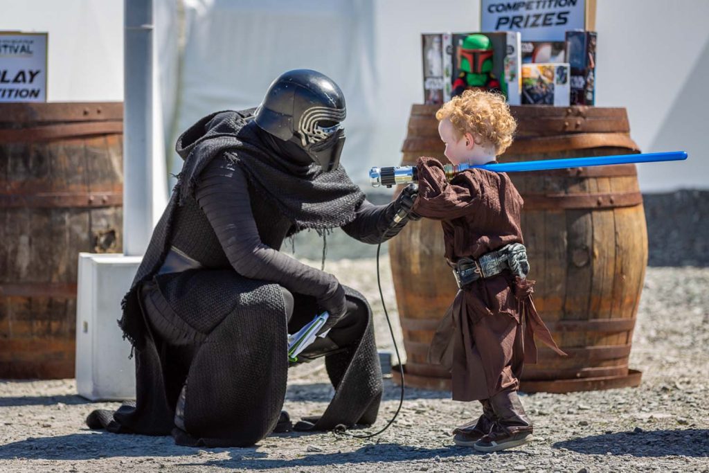 A toddler talking to a character