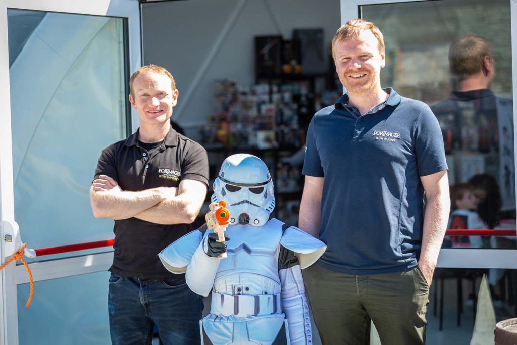Two men with a stormtrooper child