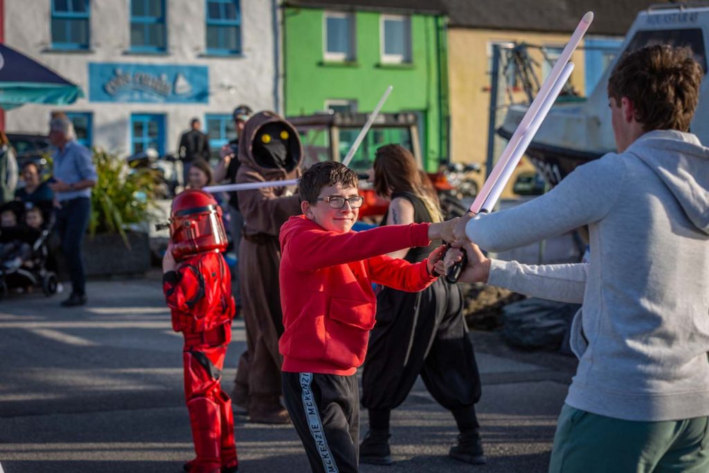 A lightsaber battle in the street