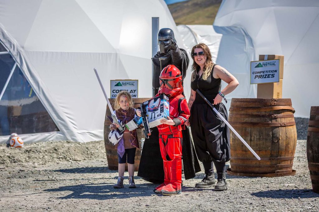 A child with a prize from the costume contest